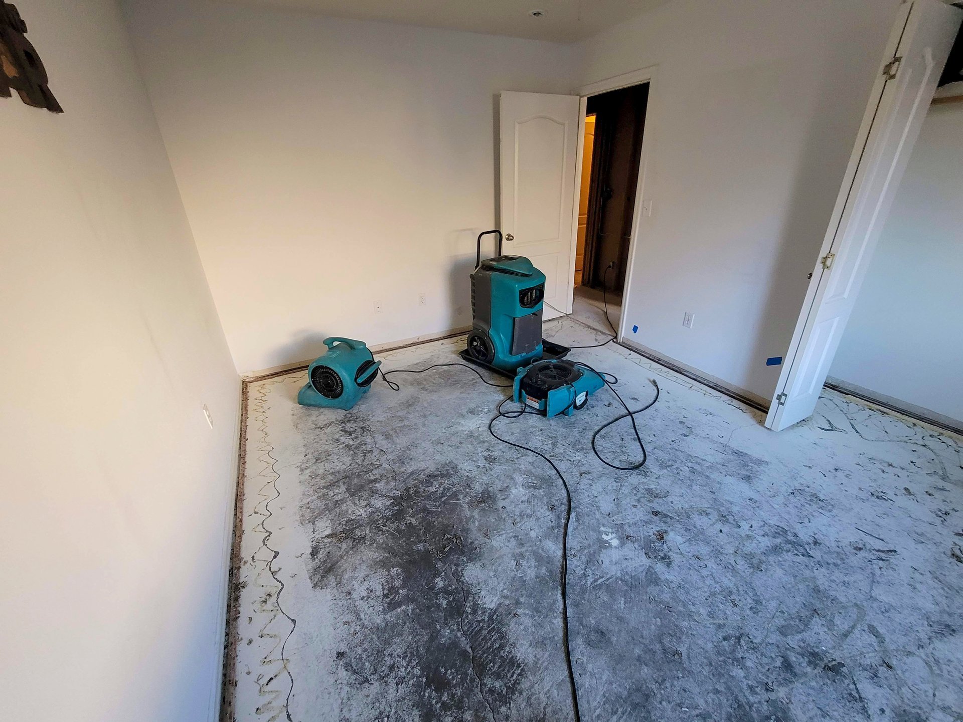 Water damage restoration with air movers and dehumidifiers